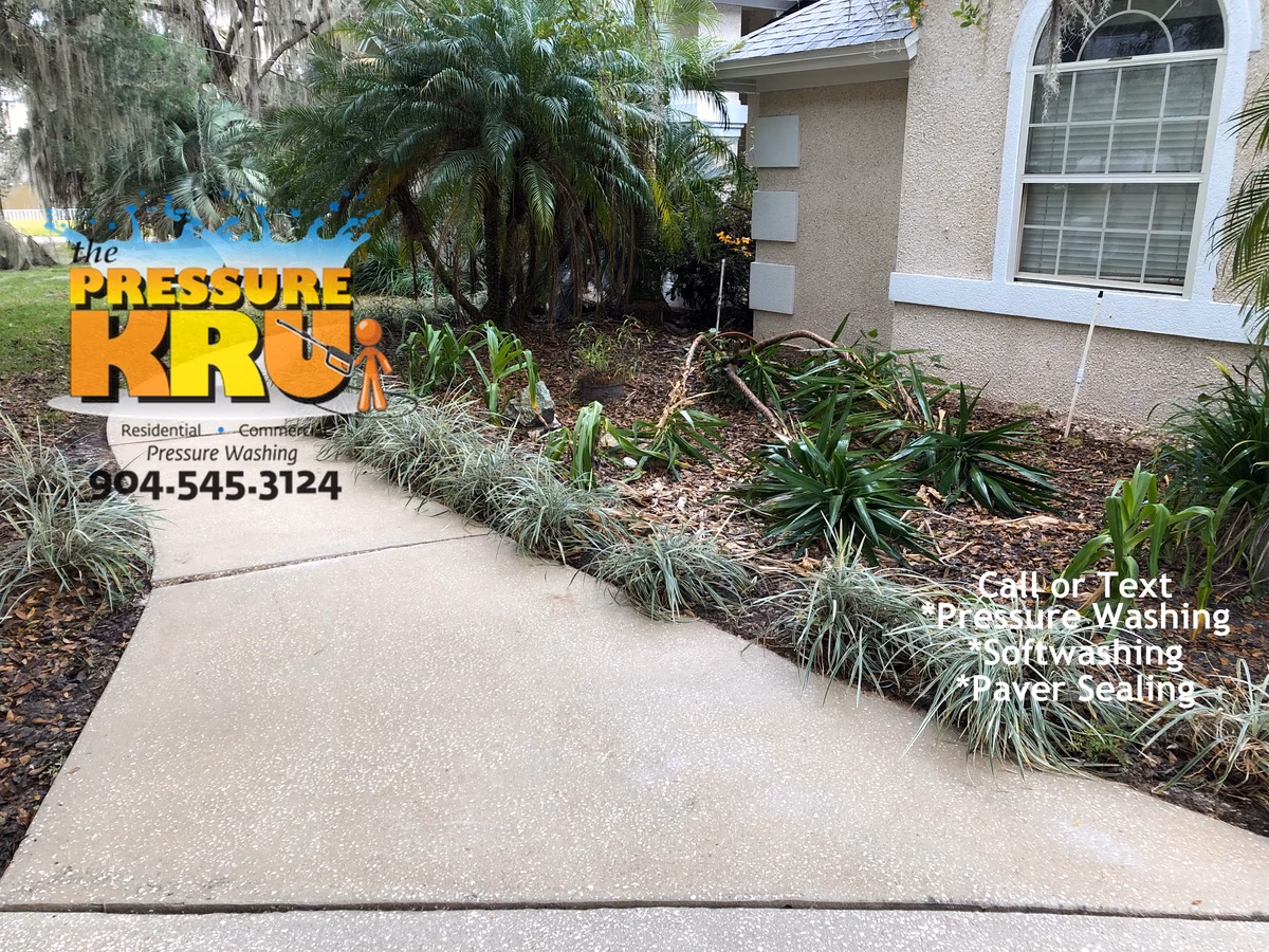 Power washing service after removing algae buildup from shaded driveway in St. Johns, FL.