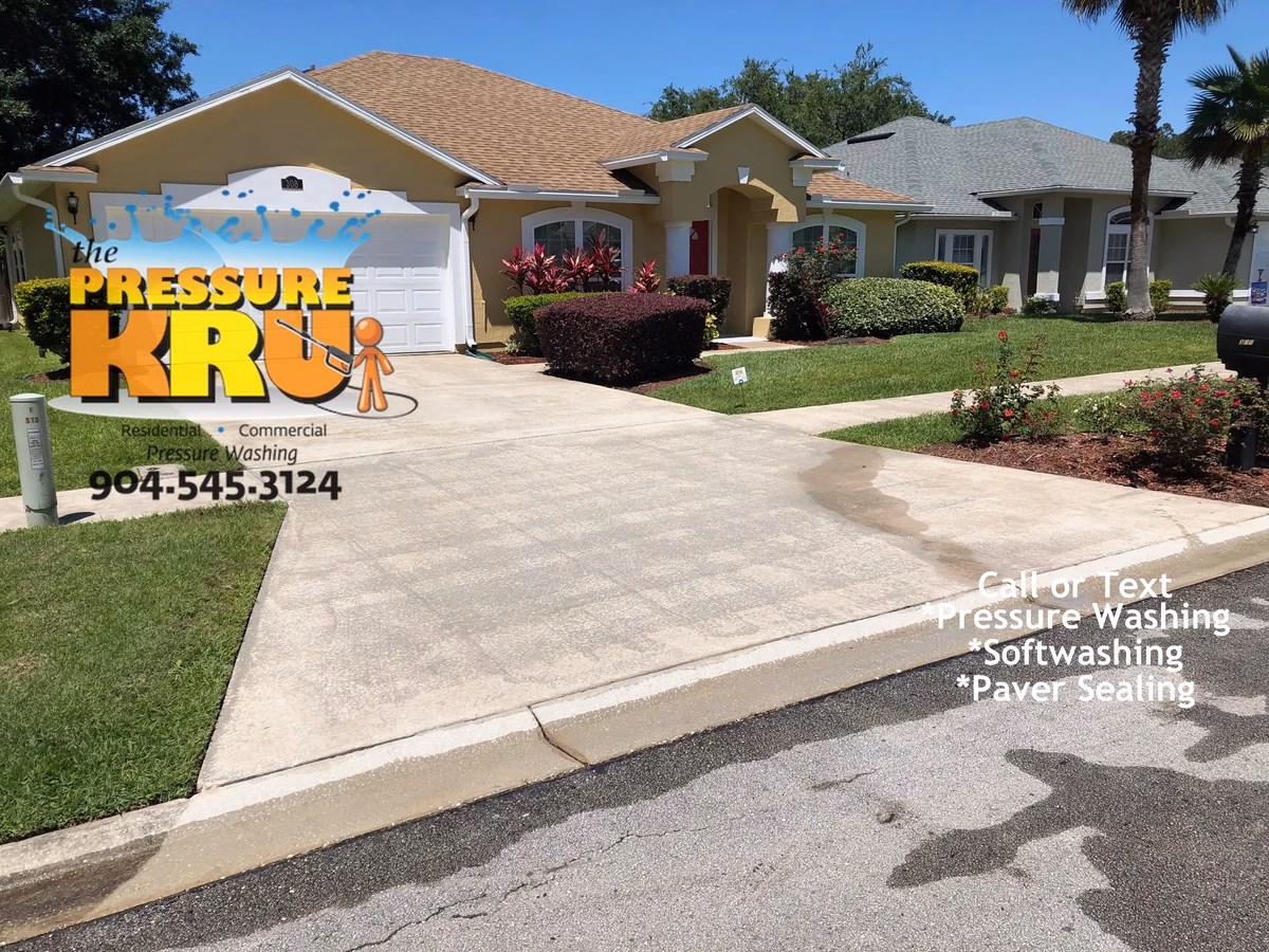 Expert driveway cleaning service eliminating tire marks and grime near St. Augustine, FL after cleaning.