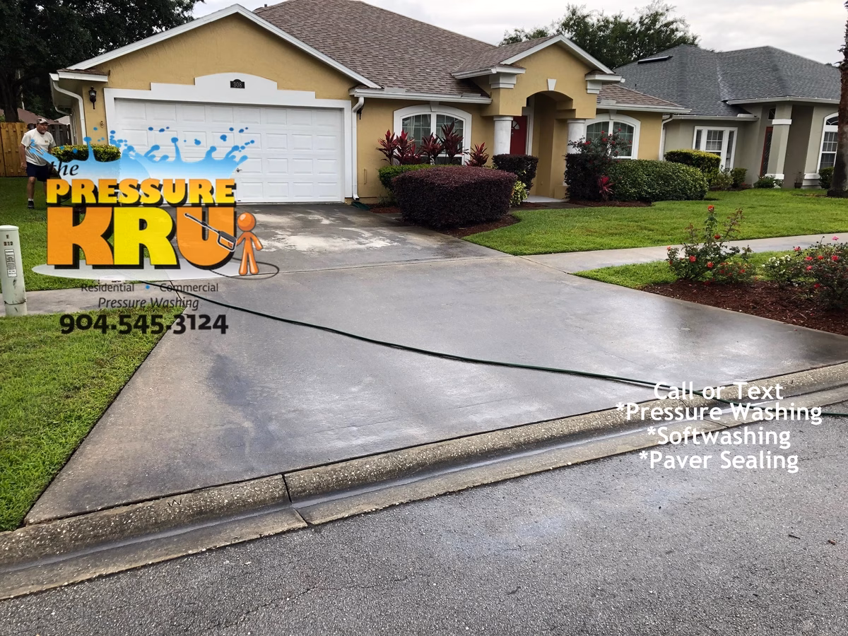Expert driveway cleaning service eliminating tire marks and grime near St. Augustine, FL before cleaning.
