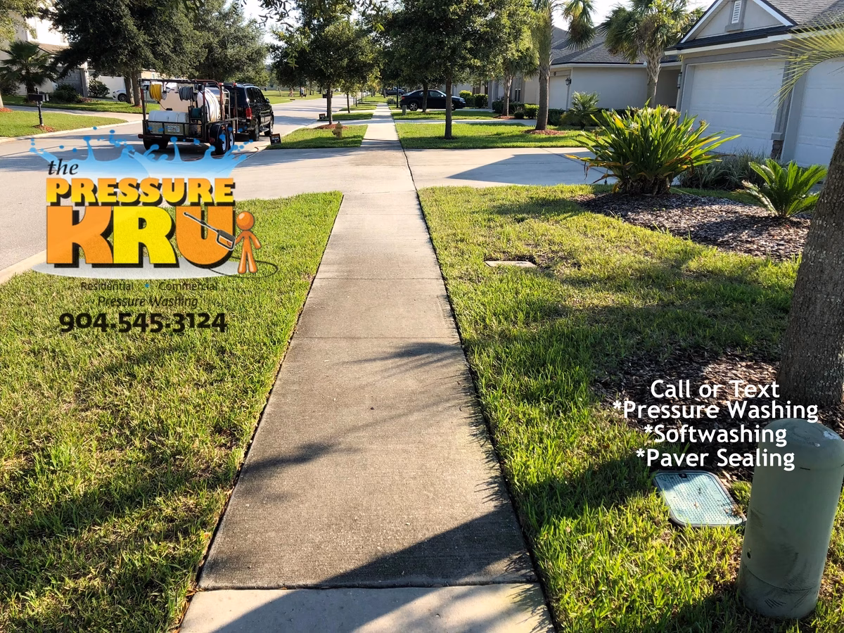 Pressure washing concrete driveway before removing deep set mold and algae in Ponte Vedra, FL