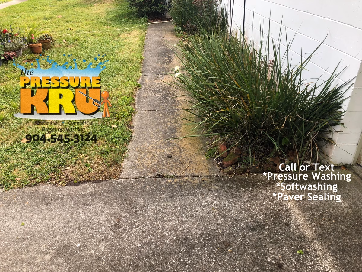 Power washing service before cleaning large residential driveway in St. Augustine, FL