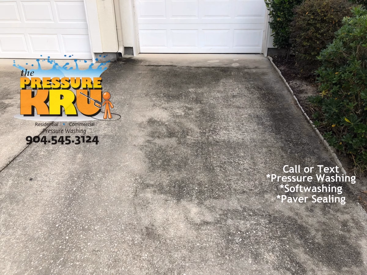 Clean white concrete driveway before professional pressure washing service in Jacksonville, FL.
