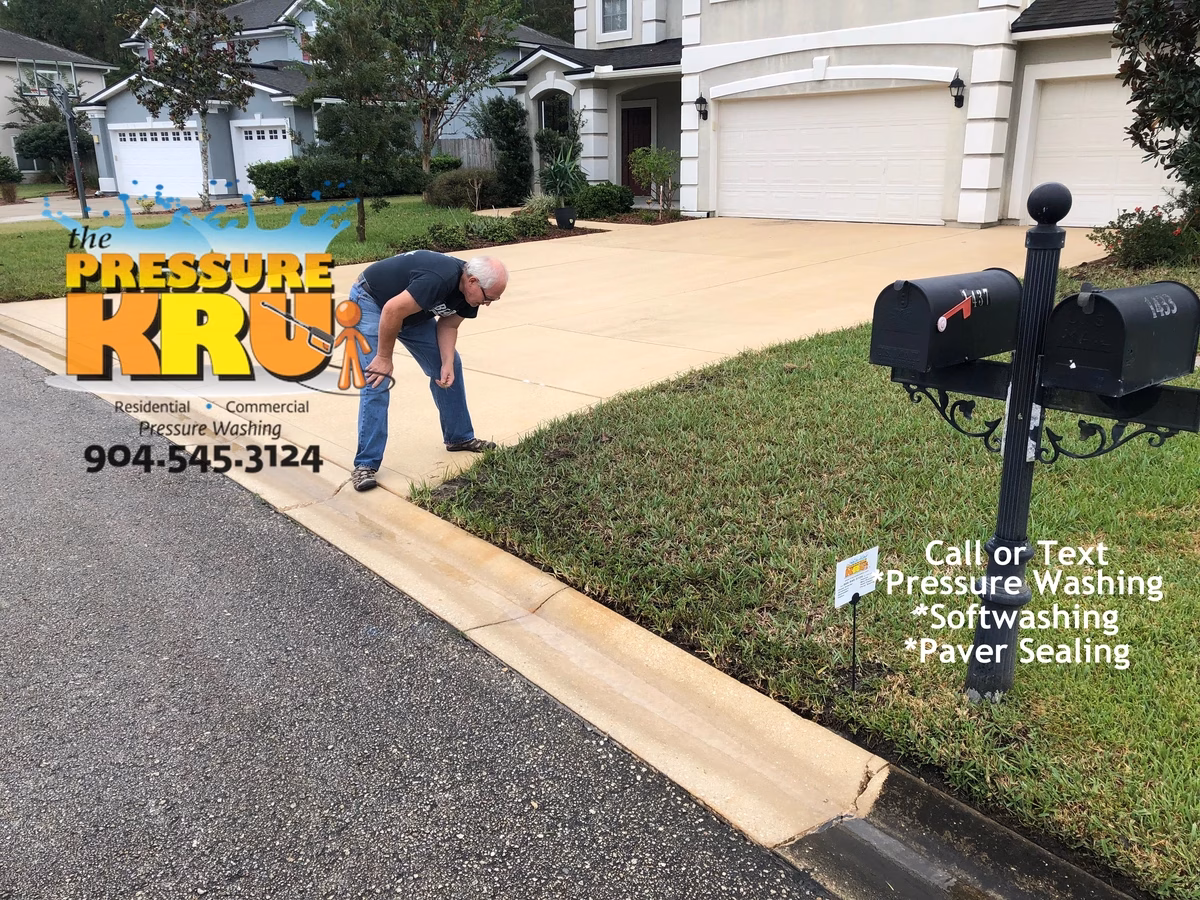 Power washing black mold driveway to remove dirt and grime in St. Augustine, FL 32092 after treatment. Home Owner stunned at the results.