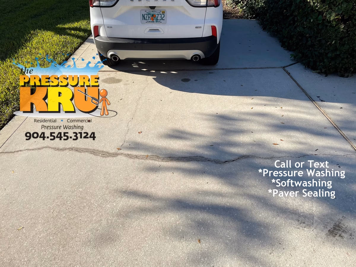 Professional concrete driveway after restoration and cleaning near St. Augustine, FL 32092