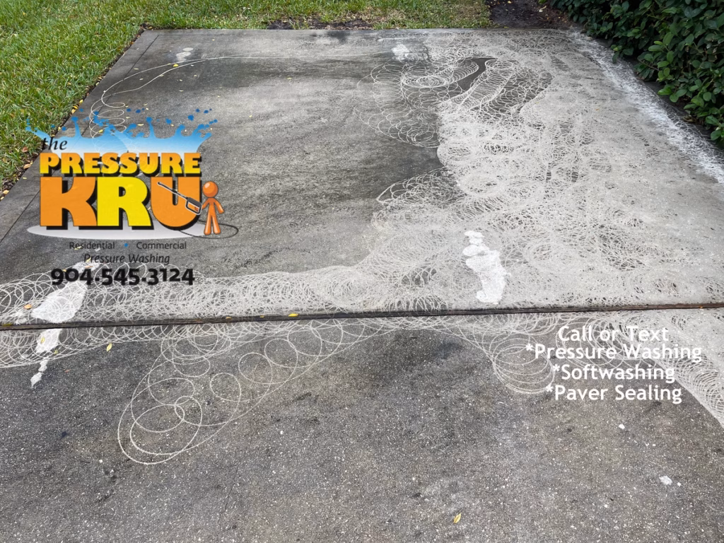 Professional concrete driveway before restoration and cleaning near St. Augustine, FL 32092