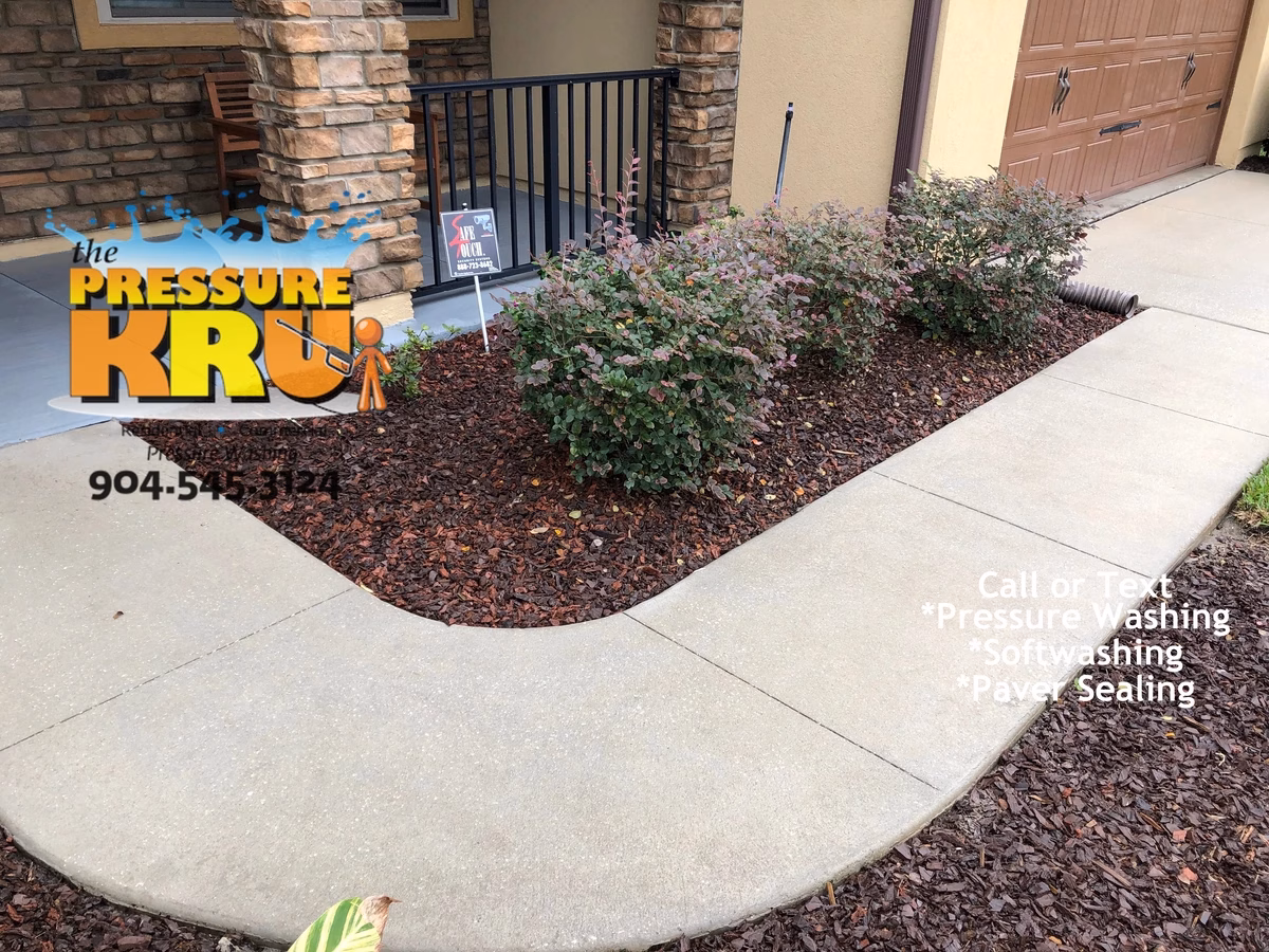 Professional concrete driveway after restoration and cleaning near St. Johns, FL.