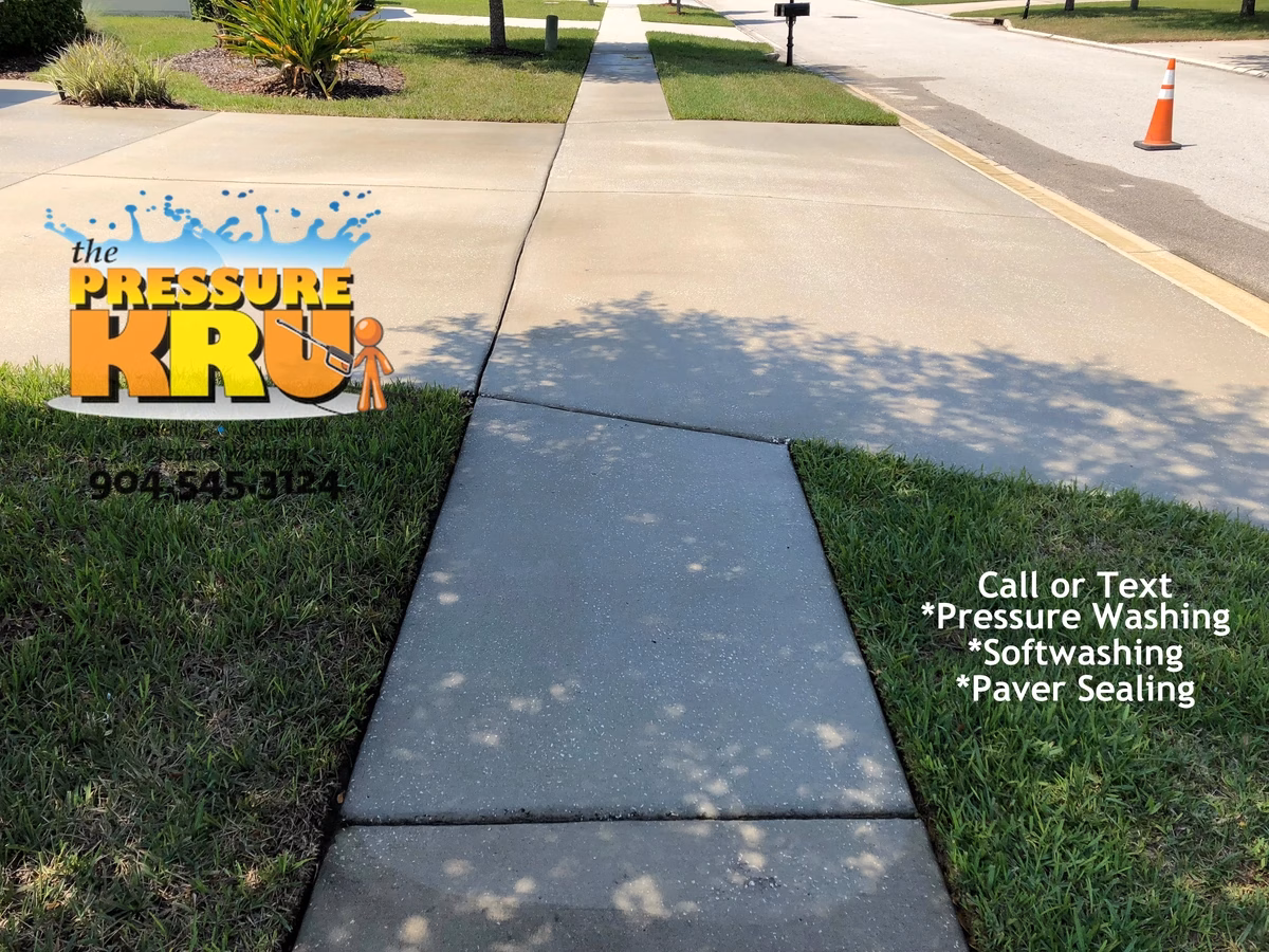 Heavy duty pressure cleaning of stained concrete driveway in Ponte Vedra, FL after cleaning.