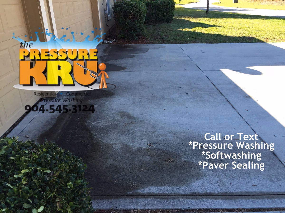 Clean white concrete driveway before professional pressure washing service in St. Augustine, FL
