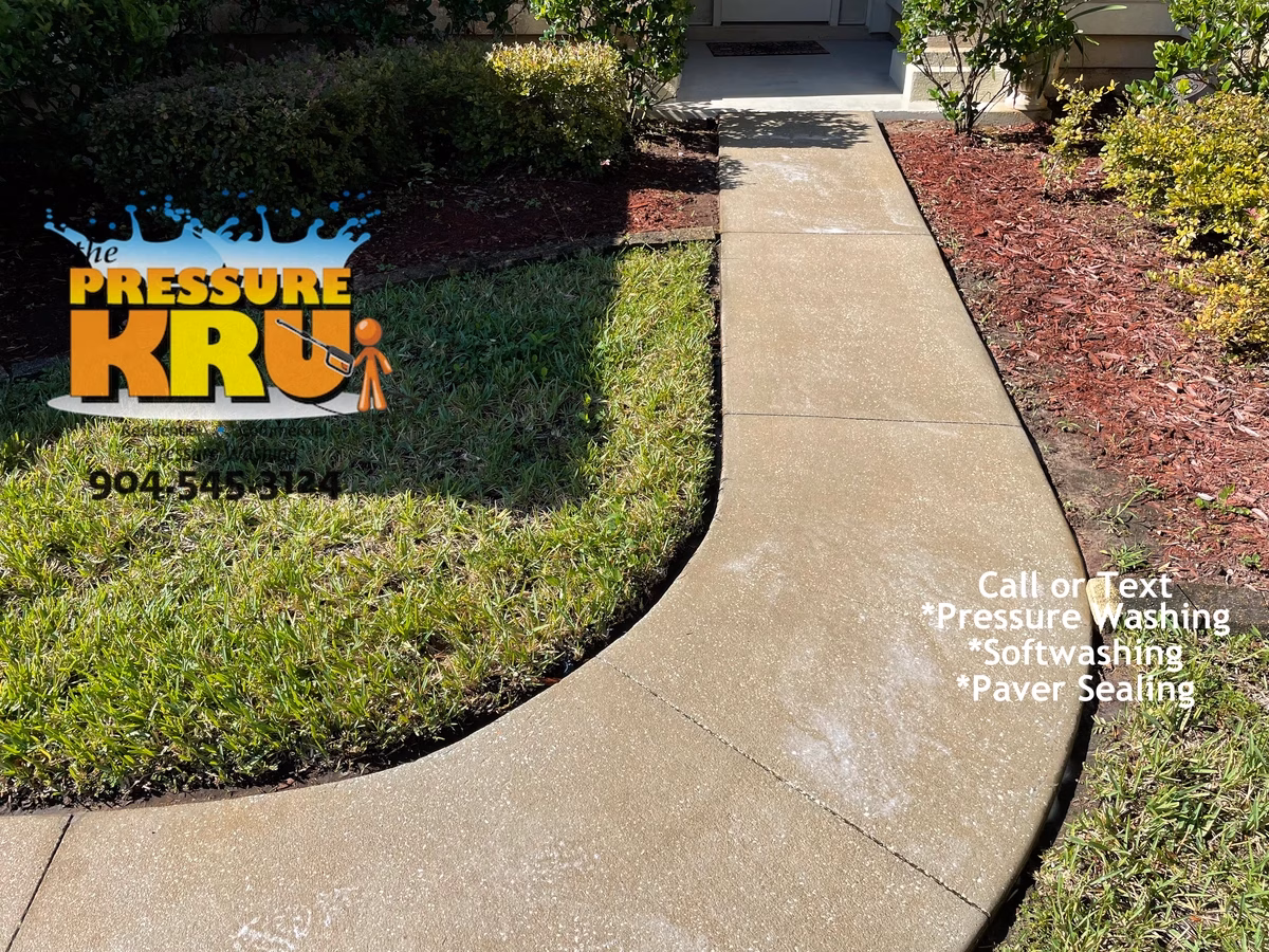 Heavy duty pressure cleaning of algae stained concrete after servicing in St. Augustine, FL.