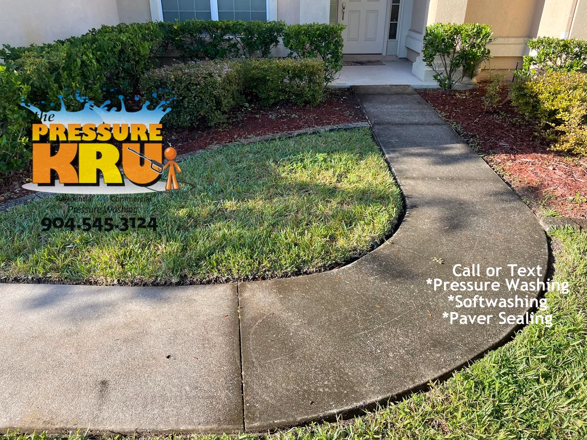 Heavy duty pressure cleaning of algae stained concrete before servicing in St. Augustine, FL.