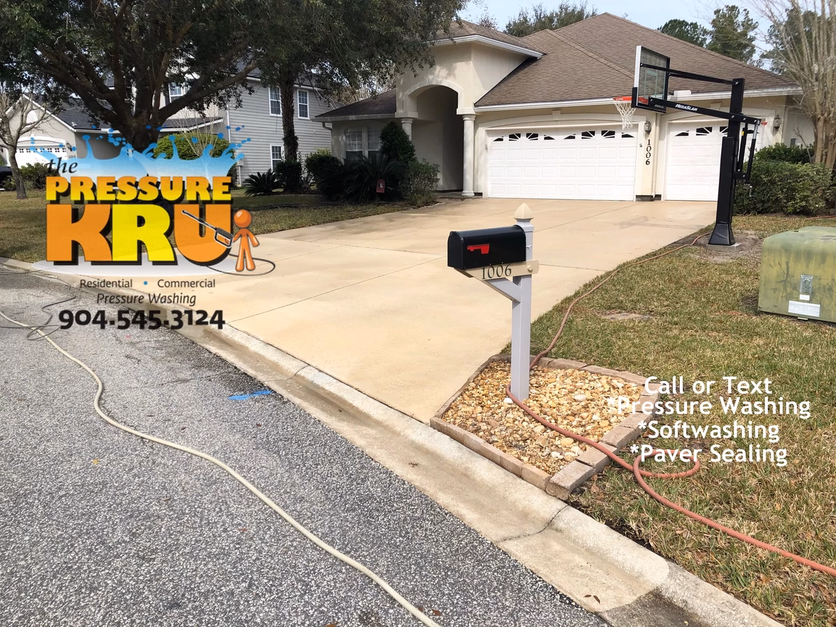 Spotless concrete driveway after power washing by The Pressure Kru in St. Johns, FL. We also removed rust stains from roofers dumpster.