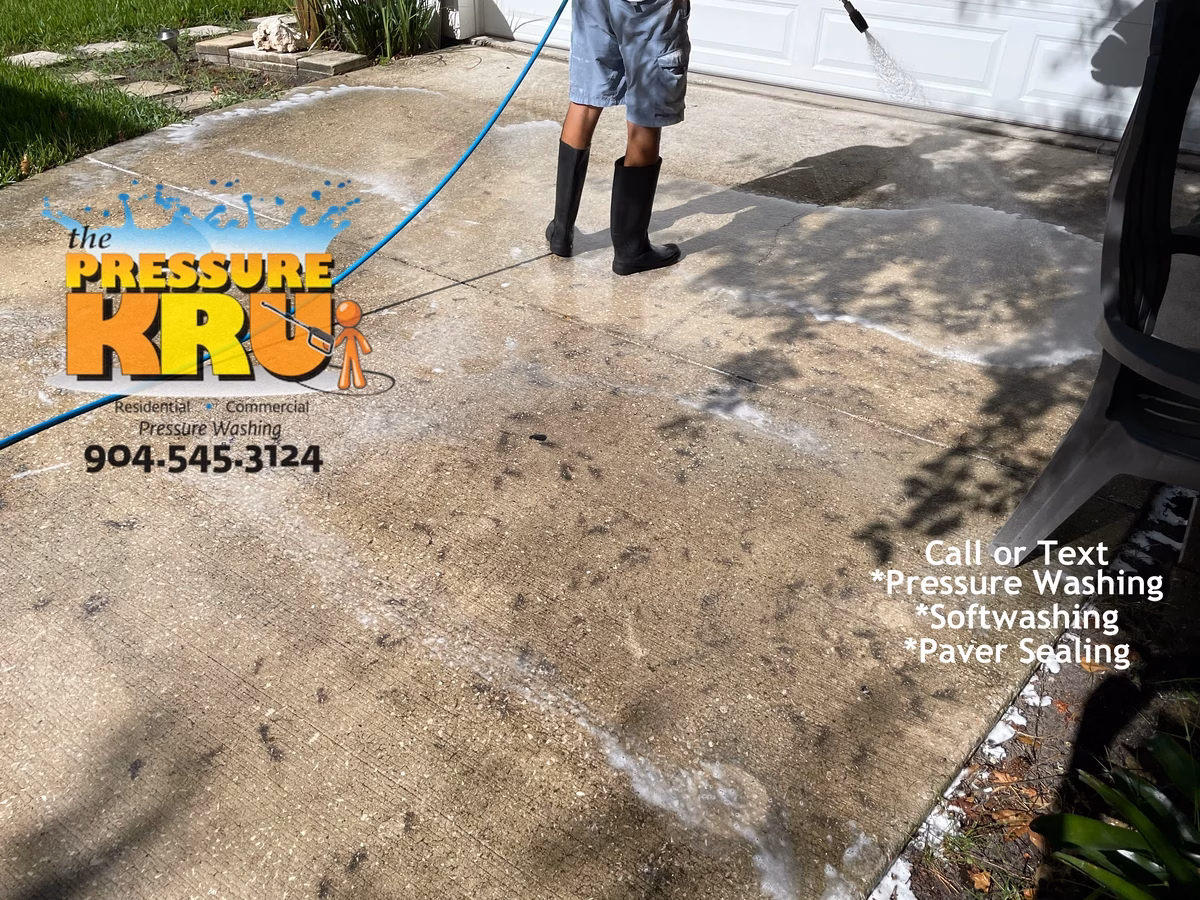 Clean white concrete driveway before professional power washing service in St. Johns, FL