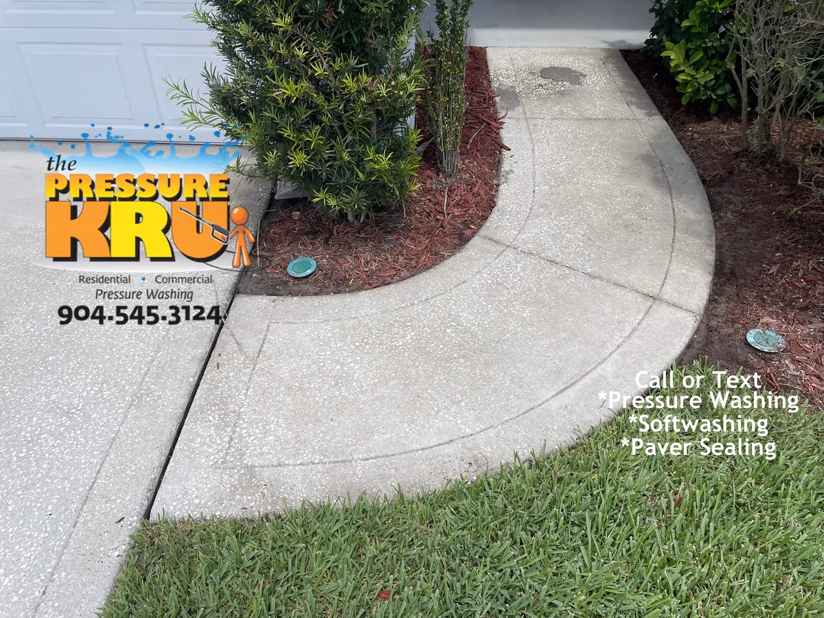 Heavy duty pressure cleaning of stained concrete driveway after service in Jacksonville, FL.