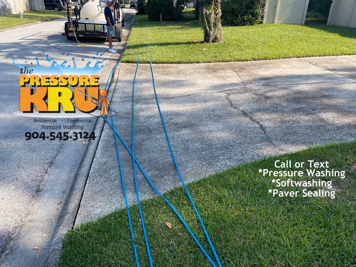 Local driveway cleaning company before restoring curb appeal with softwashing technique in St. Johns, FL.