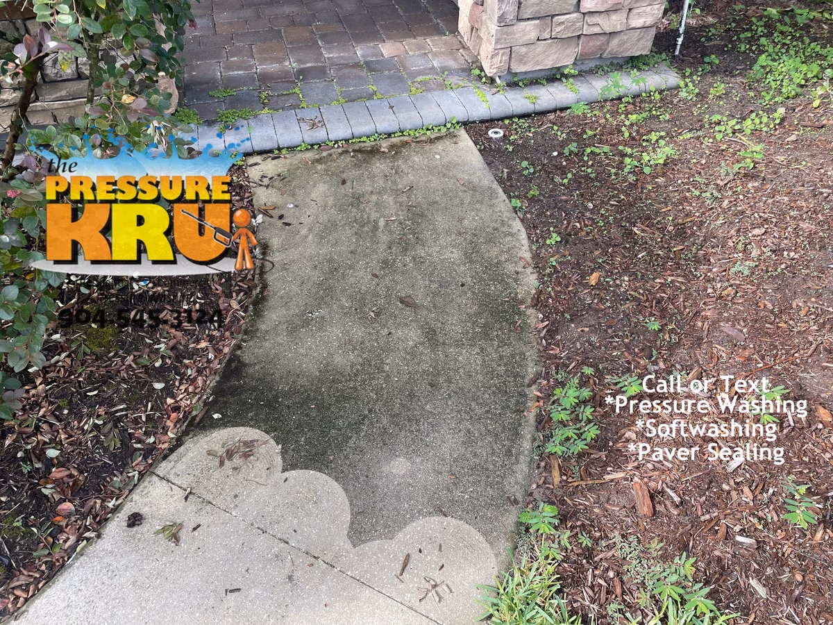 Power Washing Service cleaning large residential driveway in St Johns, FL. Home owner machine before calling.