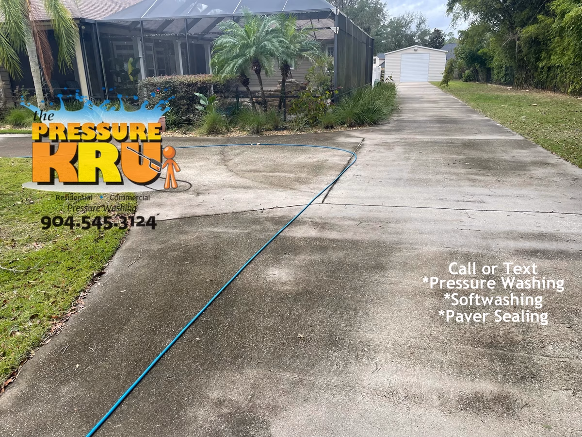 10,000 square foot residential concrete driveway cleaning in Ponte Vedra, FL. This image is before our cleaning service.