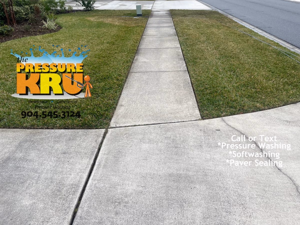 Beautiful clean concrete driveway before expert cleaning in Orange Park Country Club.