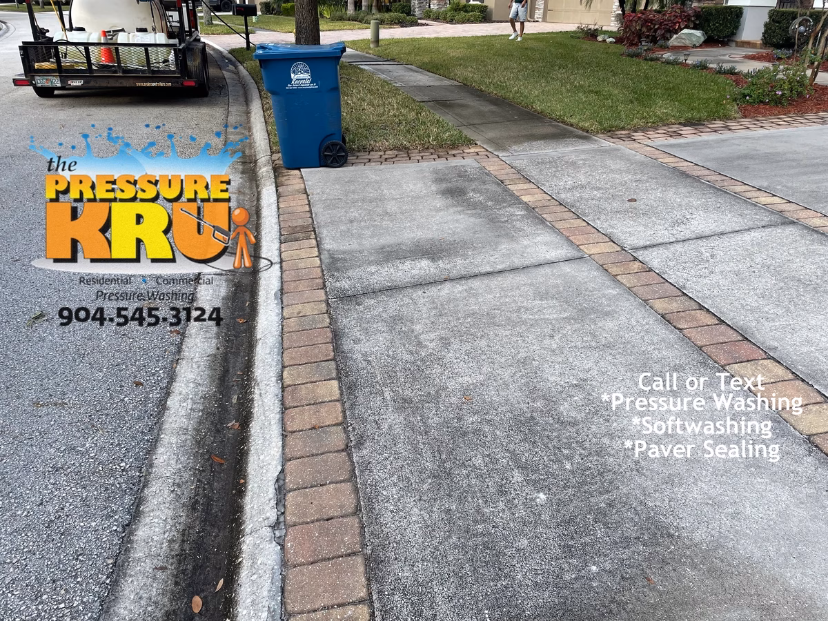Before organic stain removal from driveway using eco-friendly pressure washing in St. Johns, FL