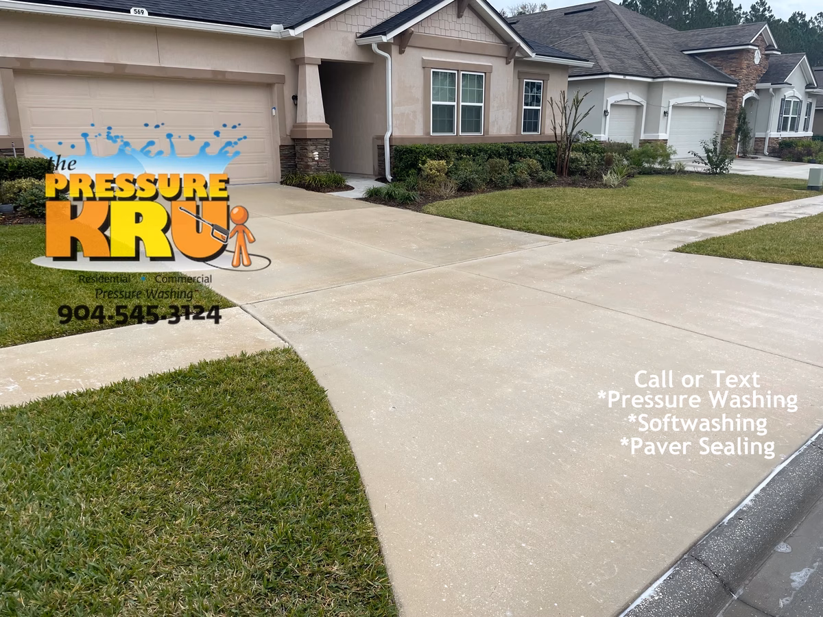 Spotless concrete driveway after power washing by local St Augustine, FL cleaning pros.