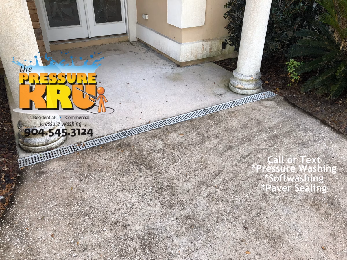 Home and Driveway pressure washing before soft washing in St. Johns, FL