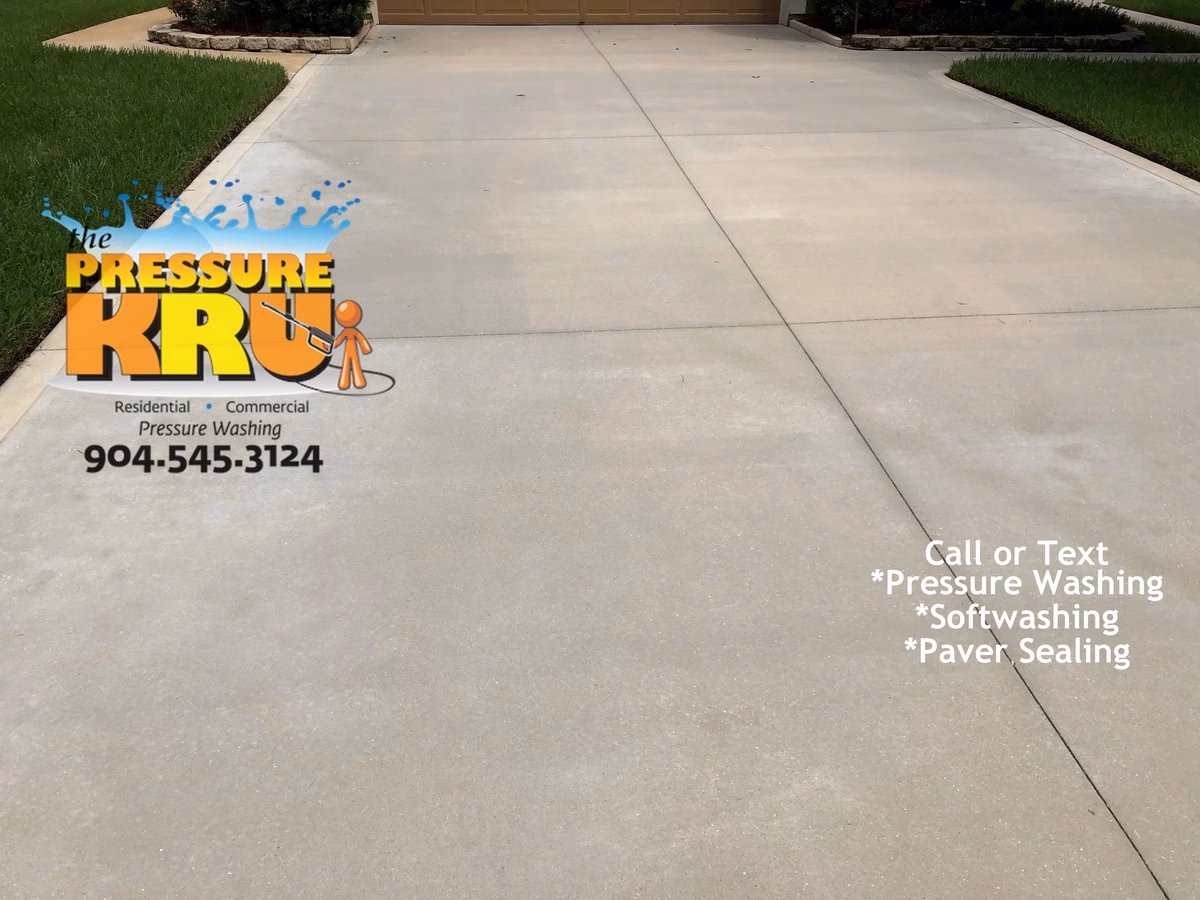 Next level cleaning of concrete driveway in St. Johns, FL after restoration.