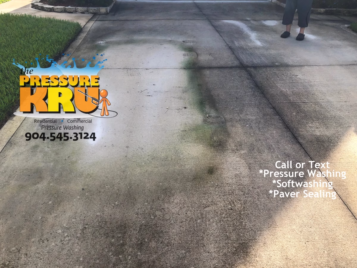 Next level cleaning of concrete driveway in St. Johns, FL before restoration.