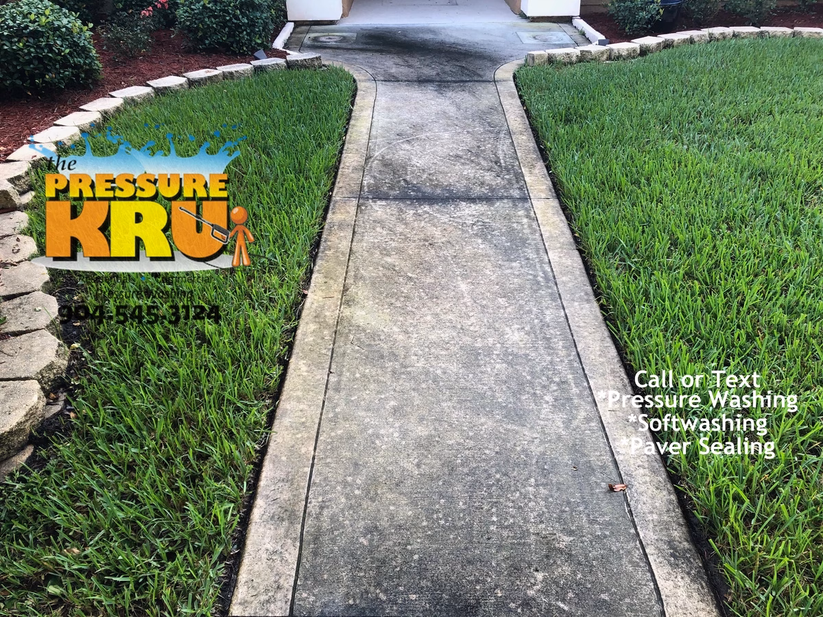 Sidewalk and driveway before restoration in Saint Johns, FL.