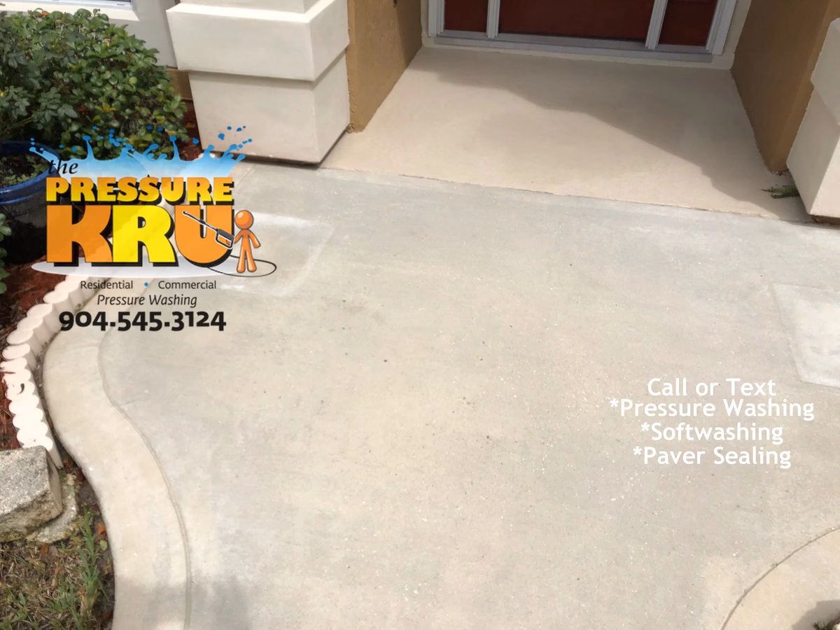 Freshly cleaned driveway and walkway in Saint Johns, FL restoring surface.
