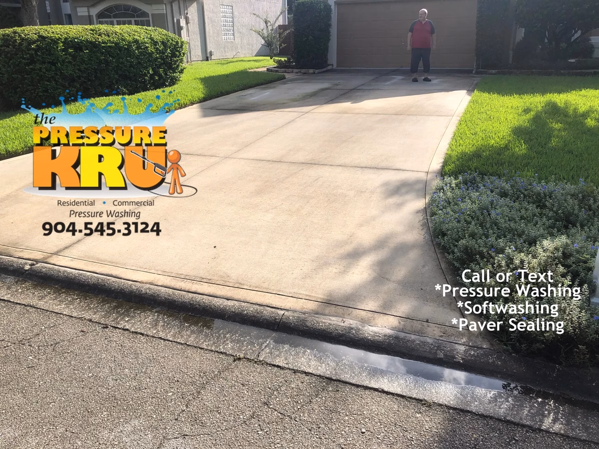 Pressure washing concrete driveway in remove organic staining in St. Johns, FL. Before starting work.