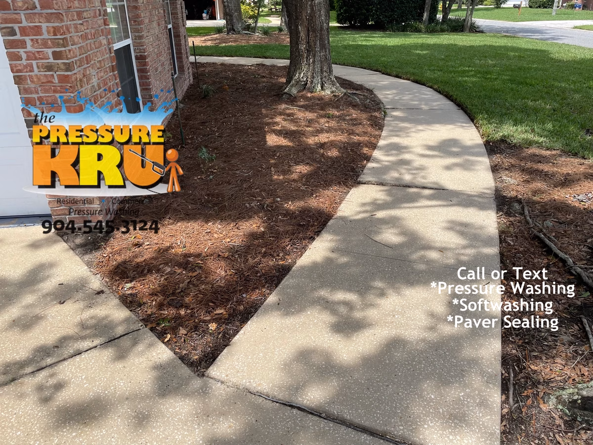 Home and driveway cleaned to improve curb appeal in St. Augustine, FL 32092 after.