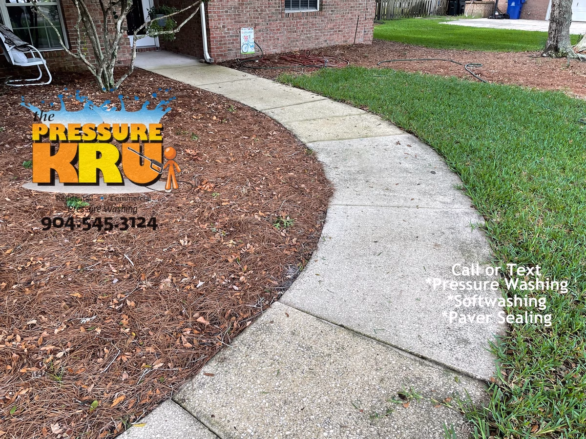 Home and driveway cleaned to improve curb appeal in St. Augustine, FL 32092 before arrival.