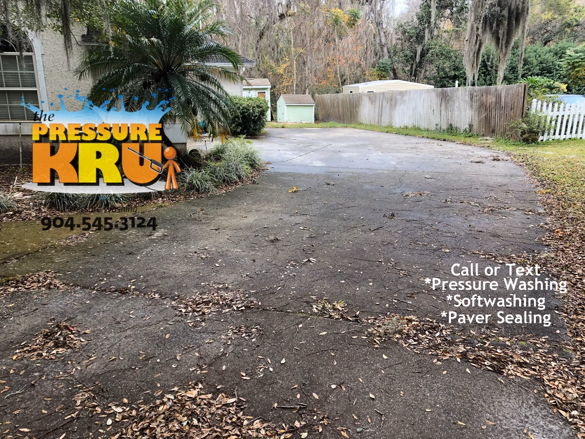 Pressure Washing Driveway before removing organic stains in St. Johns, FL.
