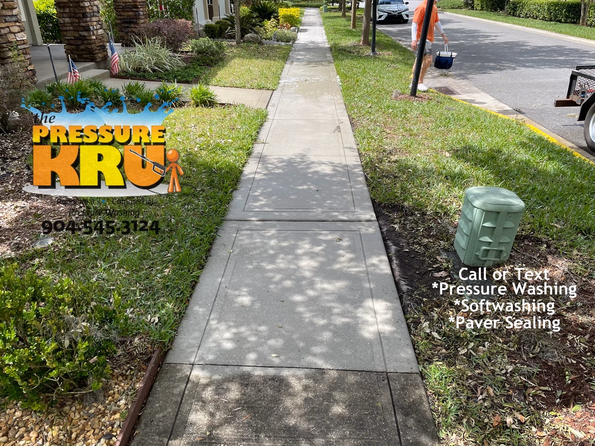 Home driveway cleaned to improve curb appeal after listing in Jacksonville, FL.