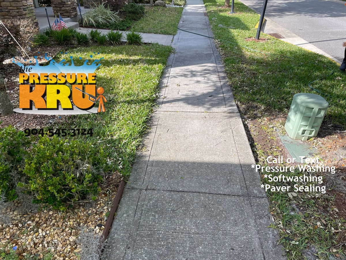 Home driveway cleaned to improve curb appeal before listing in Jacksonville, FL.