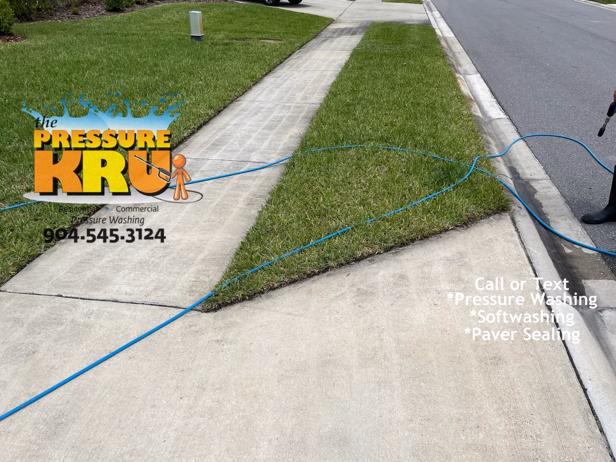 Driveway and sidewalk pressure washing in Jacksonville, FL. before proper cleaning. The half hearted bandit strikes again!