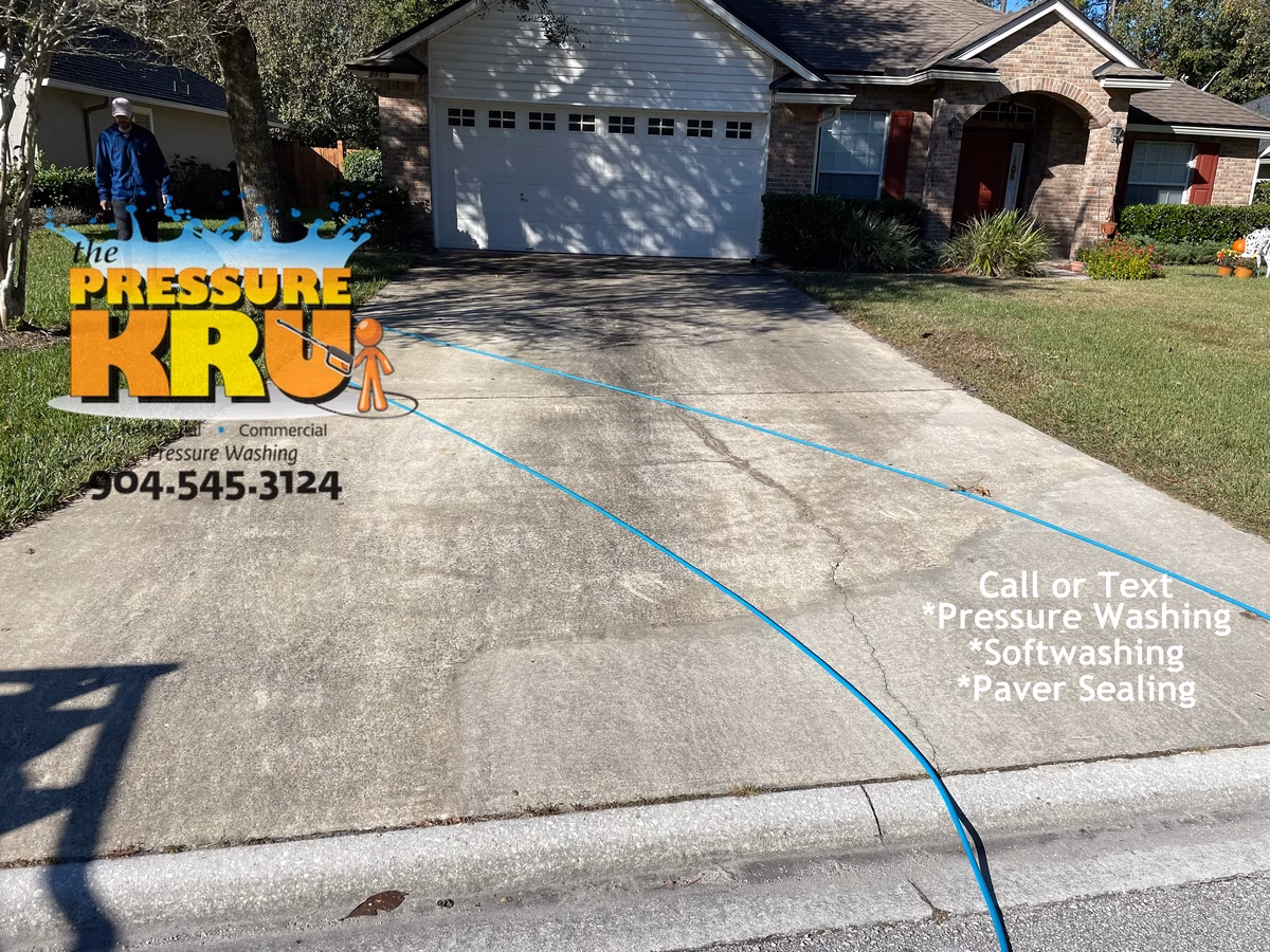 Driveway surface cleaned before soft washing and pressure washing in Jacksonville, FL