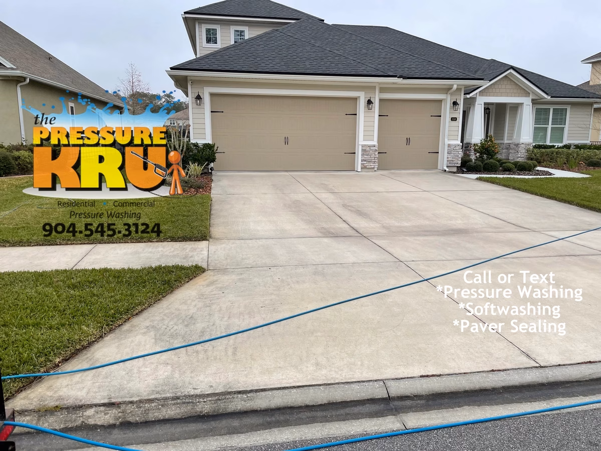 Residential concrete driveway cleaned in Jacksonville, FL. before soft washing.