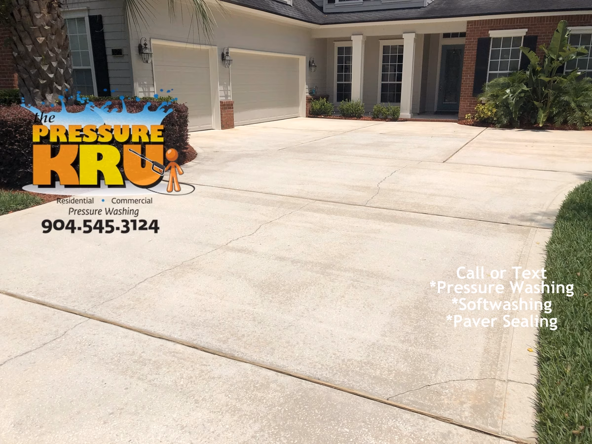 After driveway pressure washing restoring bright concrete in St. Augustine, FL.