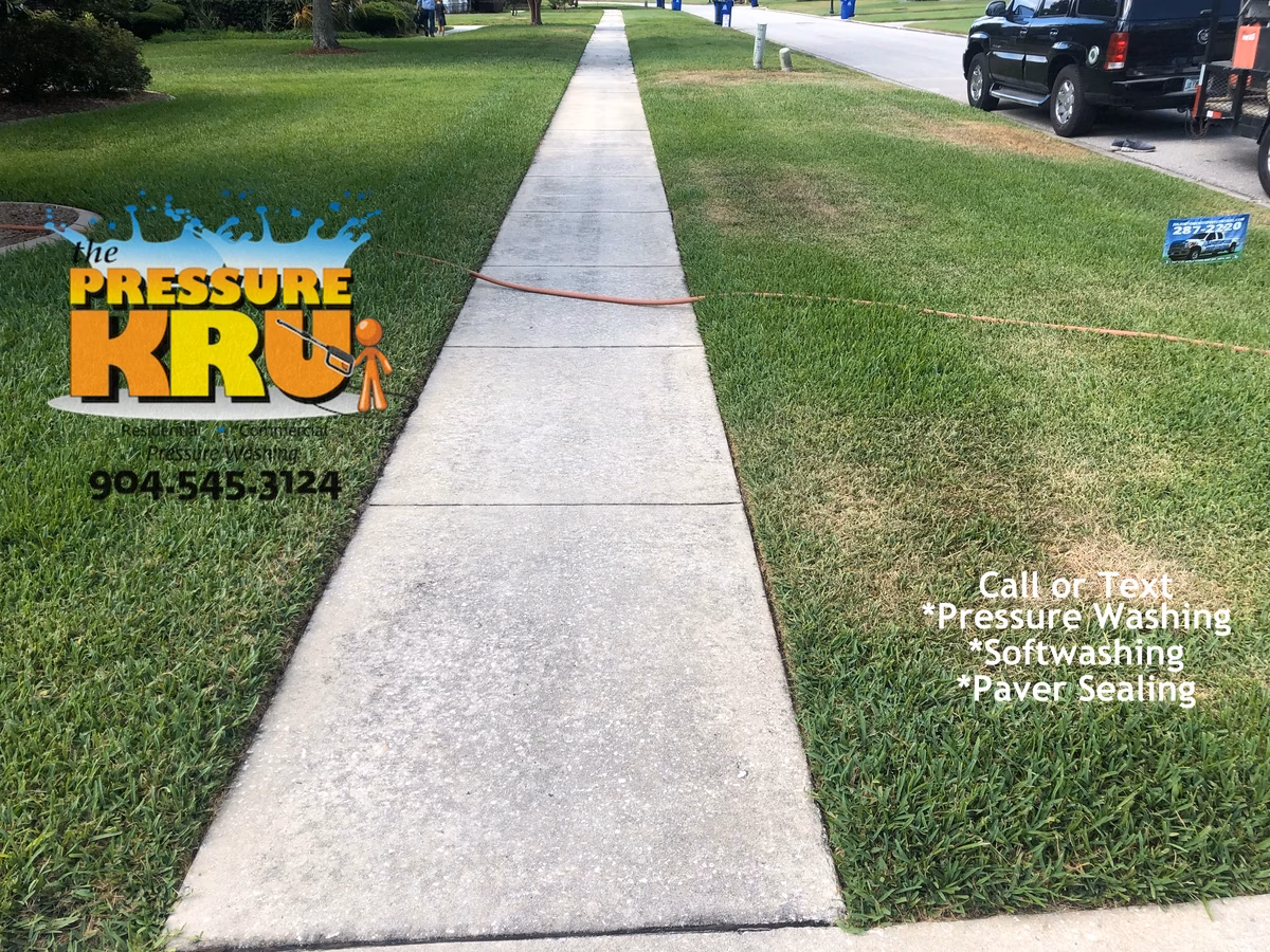 Before driveway and sidewalks pressure washing at a St. Augustine, FL home