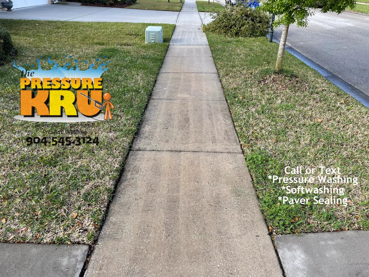Driveway and walkway pressure washing in St. Johns, FL before chemical post treatment.