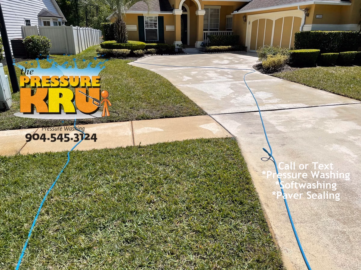 Freshly pressure washed concrete driveway at a St. Johns, County home. After completing work.