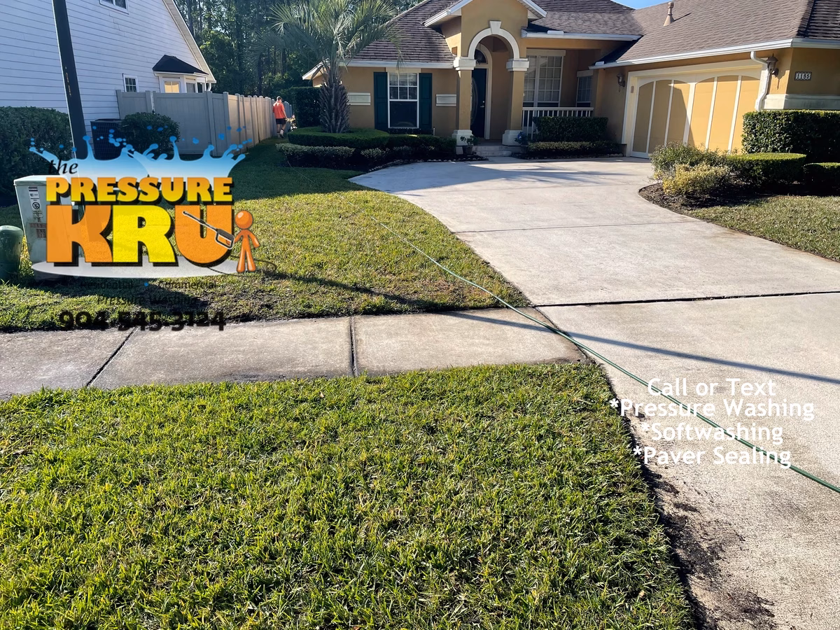 Freshly pressure washed concrete driveway at a St. Johns, County home. Before starting work.