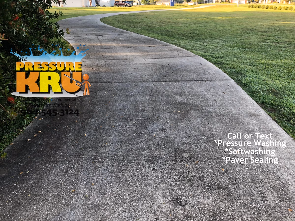 Driveway cleaning removing dark stains from concrete in St. Johns, FL before starting work.