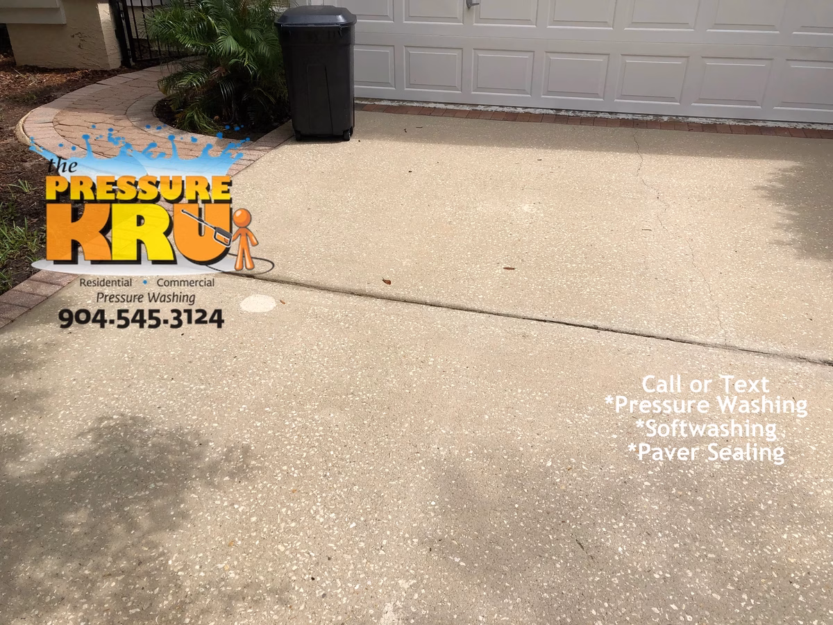 Pressure washing driveway after softwashing in Jacksonville, FL.