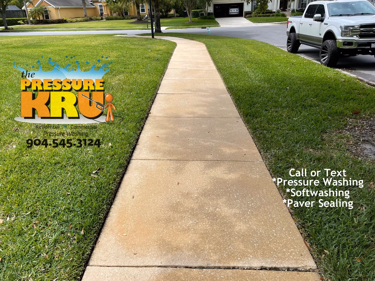 Exterior driveway and sidewalk after professional cleaning in Saint Johns, FL.