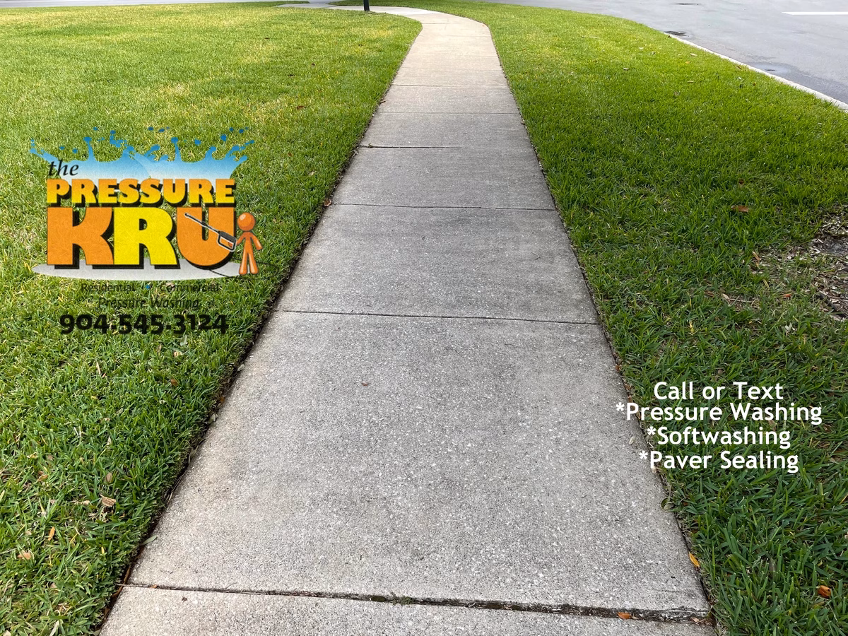 Exterior driveway and sidewalk before professional cleaning in Saint Johns, FL.