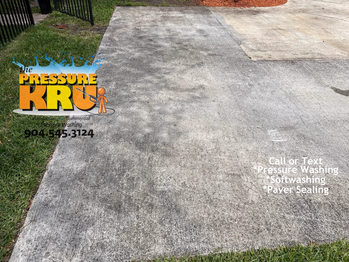 Driveway pressure washing completed in St. Johns, FL before service.