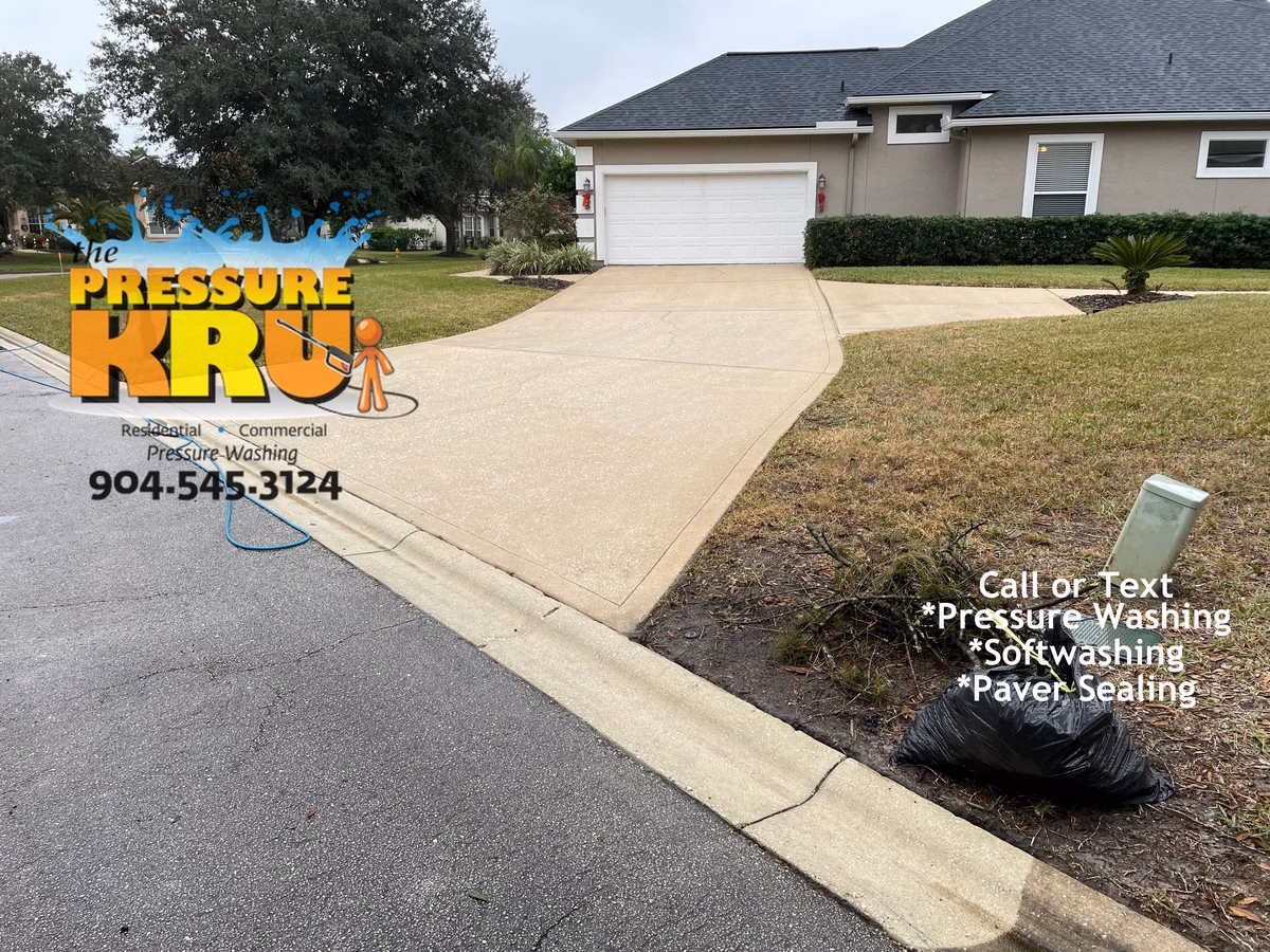 After clean residential driveway following professional pressure washing service in St. Augustine, FL. 32092.