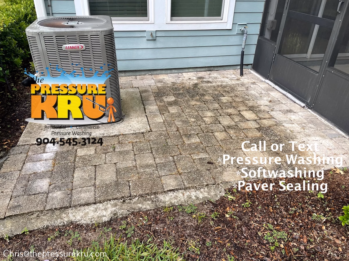 Residential paver patio pressure washing while customers at work in Bartram Park before