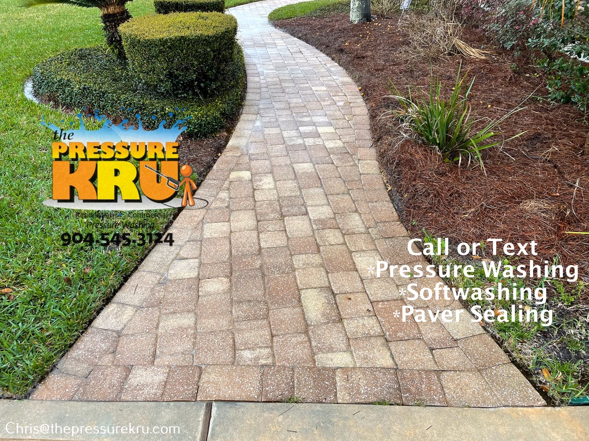 Low-pressure washing technique paver driveway after pressure washing in Julington Creek Plantation.